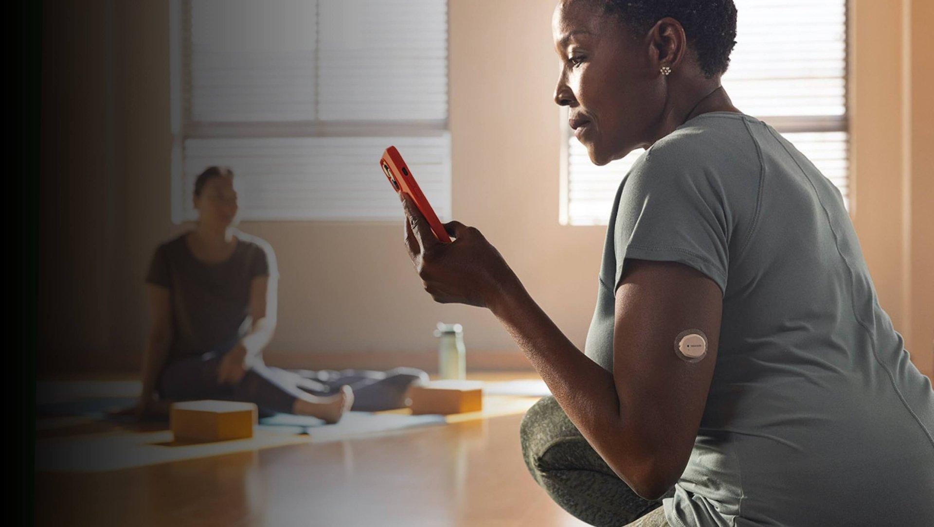 A person exercising wears a Dexcom G7 sensor